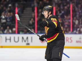 Vancouver Canucks' Andrei Kuzmenko celebrates his goal against the Tampa Bay Lightning during the first period on Tuesday night at Rogers Arena.