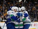 All for one and one for all. The Canucks celebrate a goal Tuesday in Nashville.