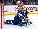 Philadelphia Flyers' Joel Farabee (86) scores on Vancouver Canucks goaltender Casey DeSmith (29) during the second period at Rogers Arena on Thursday night
