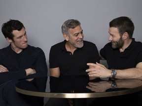 Callum Turner, from left, George Clooney and Joel Edgerton appear during a portrait session to promote the film "The Boys in the Boat," Saturday, Dec. 9, 2023, in Los Angeles.