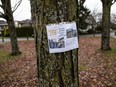 "We need help finding out who did this," reads a homemade poster near Rocky View Playground in Richmond after the double murder of a father and son.