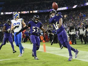 Baltimore Ravens punt returner Tylan Wallace, right, celebrates his touchdown with Ravens linebacker Del'Shawn Phillips (53) during overtime Sunday, Dec. 10, 2023, in Baltimore.