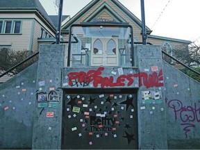 Graffiti marks the front of the Belfry Theatre in Victoria as protesters demand that it not stage The Runner, a play set in Israel.