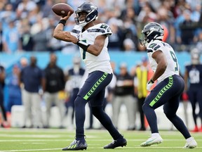 Geno Smith #7 of the Seattle Seahawks throws a pass during the second half in the game against the Tennessee Titans at Nissan Stadium on December 24, 2023 in Nashville, Tennessee.