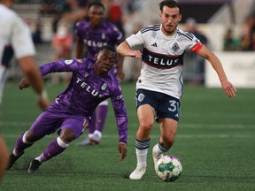The Vancouver Whitecaps say they are not exercising the 2024 contract option for long-time midfielder Russell Teibert. Pacific FC's Adonijah Reid, left, chases Vancouver Whitecaps' Russell Teibert during second half Canadian Championship semifinal soccer action in Langford, B.C., Wednesday, May 24, 2023.