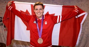Christine Sinclair poses for a photo at Canada house with the Canadian flag, Twitter has been abuzz with support for Sinclair the star of the women's bronze medal soccer team to carry the Canadian flag into the closing ceremony of the London 2012 Olympic games. Saturday August 11, 2012.