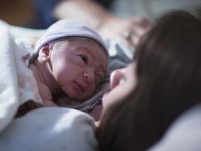 FILE PHOTO: A newborn baby rests on his mother's chest. The B.C. government says once again Noah was the most popular name in 2023 in this province.