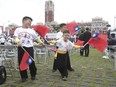 Taiwan is enjoying a spike in prominence in Canadian discourse in the past year, which experts attribute to several geopolitical reasons. Children wave Taiwan's national flags during National Day celebrations in front of the Presidential Building in Taipei, Taiwan, Tuesday, Oct. 10, 2023.