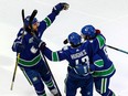 Could former Canuck Chris Tanev (left) be coming back to the team in a trade? Captain Quinn Hughes reportedly wants to make it happen.