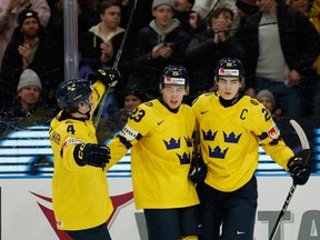 Sweden's Jonathan Lekkerimaki (C) celebrates scoring with team mates during the quarter-final match between Sweden and Switzerland of the IIHF World Junior Championship in Gothenburg, Sweden on January 2, 2024.