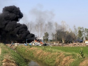 CORRECTION / Rescue Association taken and released on January 17, 2024 shows smoke rising after an explosion at a fireworks factory near Sala Khao township in Thailand's Suphan Buri province. At least 18 people have died after an explosion at a fireworks factory in central Thailand on January 17.