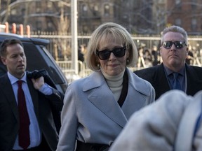 Former magazine columnist E. Jean Carroll (C) arrives at Manhattan federal court in New York on January 17, 2024 for the second defamation trial against former US President and 2024 presidential candidate Donald Trump. Carroll is seeking more than $10 million in damages in the civil trial, alleging that Trump defamed her in 2019 when he was president and she had just come out with her allegation, saying she "is not my type." This is separate to a civil case last year where another New York jury found Trump liable for sexually assaulting Carroll in a department store dressing room in 1996 and subsequently defaming her in 2022, when he called her a "complete con job." (Photo by ANGELA WEISS / AFP)