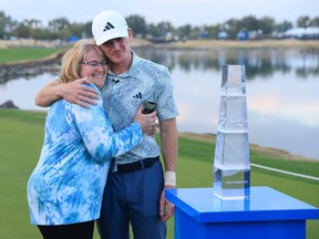 Nick Dunlap of the United States hugs his mother, Charlene, after winning The American Express at Pete Dye Stadium Course on January 21, 2024 in La Quinta, California.