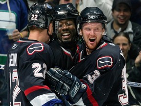 Anson Carter and the Sedin twins celebrate a goal scored on October 1, 2005. The warm and fuzzy feelings Carter once had for Vancouver are apparently over.