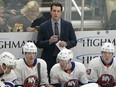 New York Islanders head coach Lane Lambert stands behind the bench during an NHL game against the Pittsburgh Penguins, Sunday, Dec. 31, 2023, in Pittsburgh.