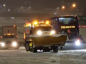 File photo: Dozens of vehicles were stranded on the Northbound lanes of the Alex Fraser bridge for several hours due to accumulating snow on Tuesday, Nov. 29, 2022. Crews worked to plow and salt the bridge deck including several transit busses and semi-trucks.