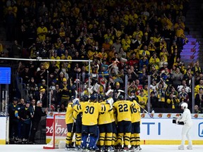 Sweden players celebrate their victory in the IIHF World Junior Championship group A ice hockey match between Canada and Sweden at Scandinavium in Gothenburg, Sweden, Friday, Dec. 29, 2023.