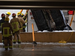 Vancouver Fire and Rescue Services attend to a parkade at the University of British Columbia Campus, where a car drove out into the ground in Vancouver on Wednesday, Jan. 17, 2024.