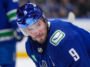 J.T. Miller wears the new metallic helmet during the game against the St. Louis Blues on Wednesday night at Rogers Arena