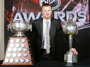 Henrik Sedin poses for a portrait with the Hart Memorial Trophy and the Art Ross Trophy during the 2010 NHL Awards at the Palms Casino Resort on June 23, 2010 in Las Vegas, Nevada. It's been a while since any Canuck has won a major NHL awards. That could change at the end of this season.