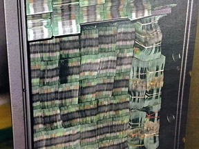 Bundles of 20-dollar bills seized in October 2015 as part of the RCMP E-Pirate investigation into money laundering at alleged underground Richmond bank Silver International.