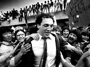 Enthusiastic Vancouver Canucks hockey fans are all over Dave 'Tiger' Williams as the hockey team arrived at Vancouver Airport after game 2 of the 1982 Stanley Cup Final.