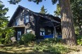A 1917 log house at 4686 West 2nd may be demolished if a plan for three new homes on the site is approved.