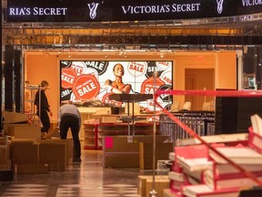 Workers pack up the Victoria's Secret store at Robson and Burrard last week.