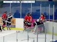 Screenshot of a referee trying to pull Richmond Sockeyes defenceman Eithan Grishin off North Vancouver Wolf Pack goaltender Evan Paul during a fight in Richmond's 6-1 win at Minoru Arena on Jan. 25, 2024.