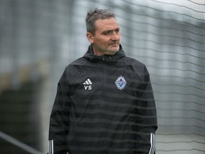 The Vancouver Whitecaps are maintaining an air of confidence when it comes to bringing in reinforcements ahead of the upcoming 2024 Major League Soccer season, despite two high-profile absences. Head coach Vanni Sartini said while the transfer market can be hard to predict, he's confident of having some new signings to welcome. Sartini walks onto the field for one of the MLS soccer club's training sessions, in Vancouver, B.C., Wednesday, Aug. 9, 2023.