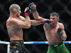 Sean Strickland, left, fights Dricus Du Plessis during a middleweight title bout at UFC 297 in Toronto on Sunday, Jan. 21, 2024.