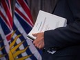 Under B.C. law, unexplained wealth orders must be applied for in each case through the courts and meet certain tests. If successful, the information from the orders can then be used to pursue civil forfeiture cases where the province aims to seize assets or money. In 2018 here, B.C. Attorney General David Eby holds a report on anti-money laundering practices in the province.