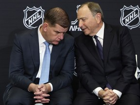 NHLPA executive director Marty Walsh and NHL commissioner Gary Bettman chat on Feb. 2, 2024 at Scotiabank Arena in Toronto.