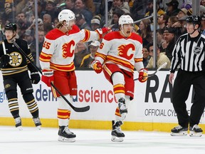 Andrei Kuzmenko #96 of the Calgary Flames celebrates his goal with Noah Hanifin #55 against the Boston Bruins during the first period at the TD Garden on February 6, 2024 in Boston, Massachusetts.
