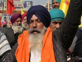 Farmers shout slogans during a demonstration against central government over their various demands, in Amritsar on Feb. 13.