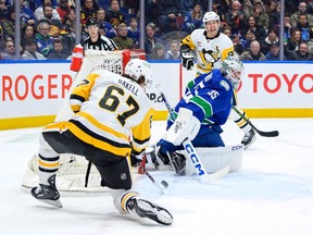 Rickard Rakell of the Pittsburgh Penguins scores a goal on Thatcher Demko of the Vancouver Canucks during the second period at Rogers Arena on Tuesday night