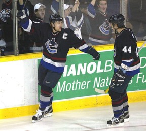 Vancouver Canucks' Markus Naslund (left) celebrates a goal against the Edmonton Oilers with Todd Bertuzzi.