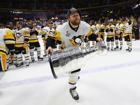 Phil Kessel celebrates with the Stanley Cup Trophy after the Pittsburgh Penguins defeated the Nashville Predators 2-0 in Game Six of the 2017 NHL Stanley Cup Final at the Bridgestone Arena on June 11, 2017 in Nashville, Tennessee.