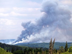 Smoke billows from the Donnie Creek wildfire burning north of Fort St. John, B.C., on July 2, 2023. The fire is the largest in B.C. history.