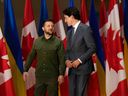Ukrainian President Volodymyr Zelenskyy, left, and Prime Minister Justin Trudeau talk before a joint press conference on Parliament Hill in Ottawa on Sept. 22, 2023.