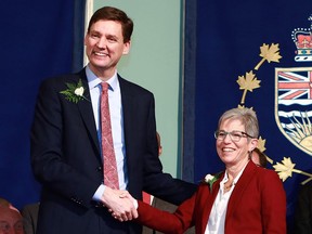 Post-secondary education and future skills Minister Selina Robinson is congratulated by Premier David Eby during the swearing-in ceremony at Government House in Victoria, B.C., on Wednesday, December 7, 2022.