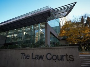 A British Columbia Supreme Court judge has rejected an application to exclude the father of a murdered 13-year-old girl from following post-trial proceedings. The Law Courts building, which is home to B.C. Supreme Court and the Court of Appeal, is seen in Vancouver, on Thursday, Nov. 23, 2023.