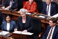 Finance Minister Katrine Conroy tables the budget in the legislative assembly in Victoria on Thursday.
