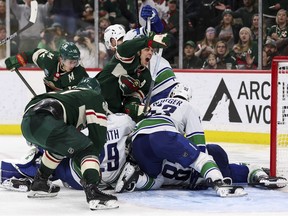 The piling onto the first-place Canucks started in Minnesota on Monday and hasn't stopped.