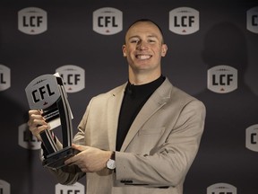 B.C. Lions' Mathieu Betts with his award for the Most Outstanding Defensive Player at the 2023 Canadian Football League (CFL) Awards in Niagara Falls, Ont. Thursday, November 16, 2023. Betts, one of the CFL's most coveted free agents, is returning to the NFL.