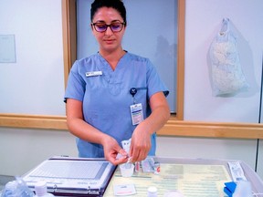 Ana, a registered nurse, dispenses medication at Abbotsford Regional Hospital.