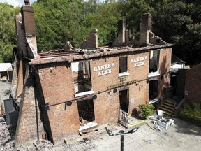 The burnt out remains of The Crooked House pub near Dudley, England, on July 8,, 2023. The owners of a quirky 18th century British pub destroyed in a fire last year have been ordered by a local council to rebuild it, keeping with its previous lopsided specifications. The watering hole -- known as the Crooked House for its leaning walls and tilting foundation -- in the village of Himley in central England, was gutted by a fire and subsequently demolished last August.