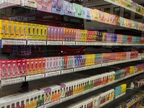 A major Canadian tobacco company says it is "extremely disappointed" in British Columbia's decision to move the sale of flavoured nicotine pouches behind pharmacy counters. A selection of colourful disposable vapes on display for sale in a souvenir shop in London, Monday, Jan. 29, 2024.