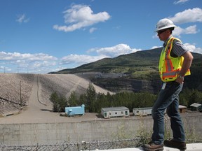 A worker in front of the W.A.C. Bennett dam in northeast B.C.