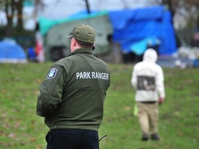 Vancouver rangers at the homeless encampment in CRAB park.
